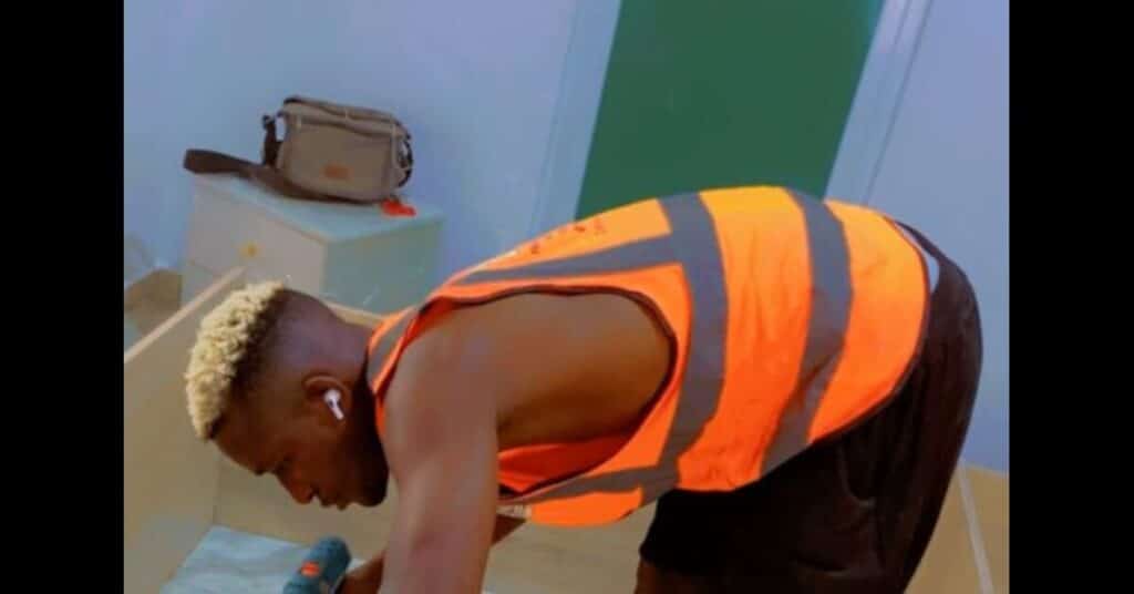 Godwin Samuel Niniola Balancing Football with Carpentry